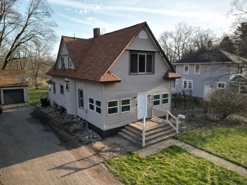 Parma Home on One Acre with Pole Barn and Lofted Garage
