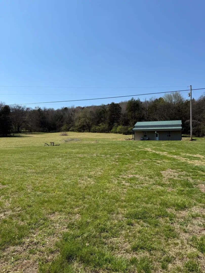 Private 35.63 Acre Retreat with Modern Barn Living, Utilities, Spring, & Wildlife Galore located in Trousdale County, Tennessee