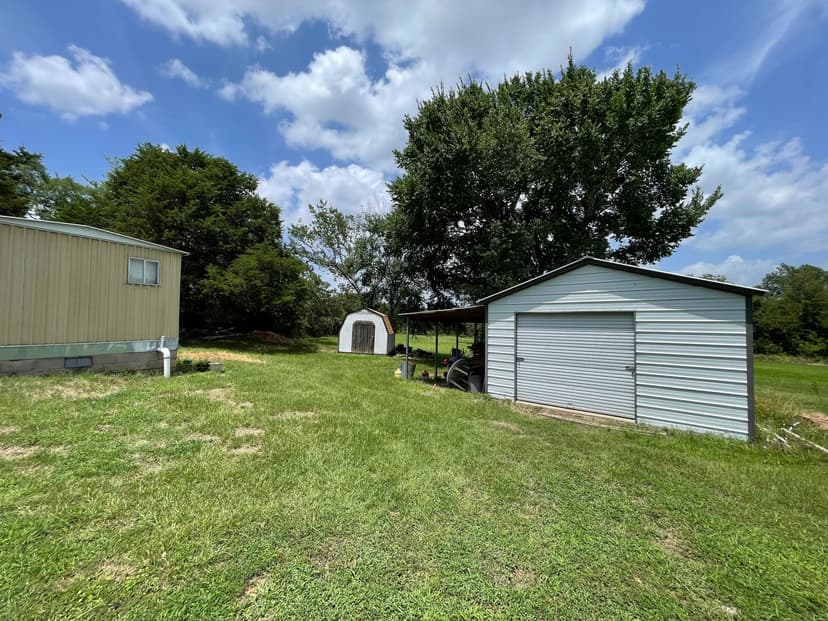 Sardis Lake property: Lake House with outbuildings