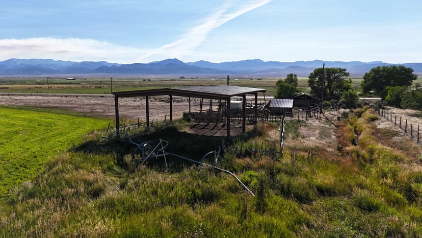 50 acres near Panguitch with Highway 89 frontage, utilities, water rights, barns, irrigation, and agricultural setup. Flat, accessible land with development or agricultural potential.