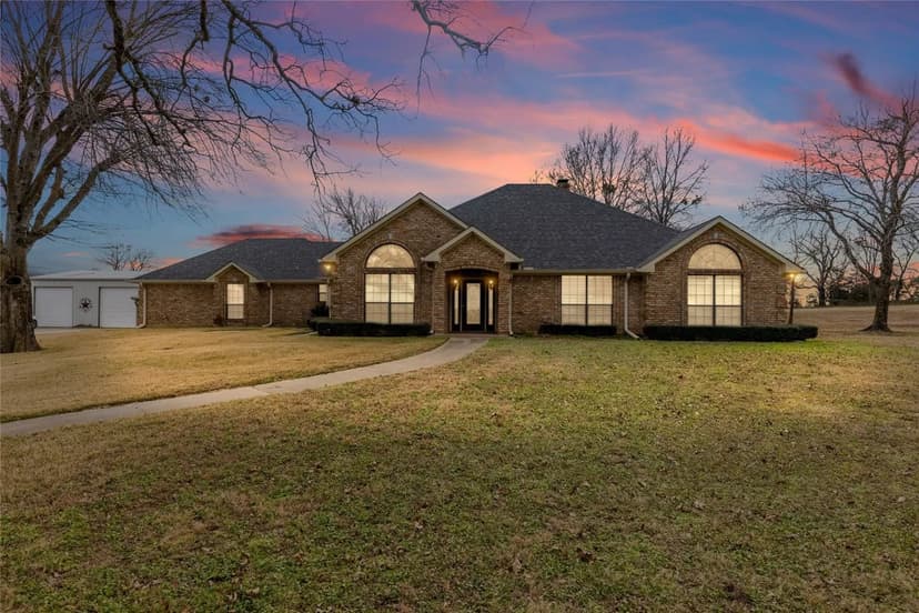 Modern Sanctuary Comes with 68 Acres, Brick Home, Workshop, & Apartment near Lake Cypress Springs