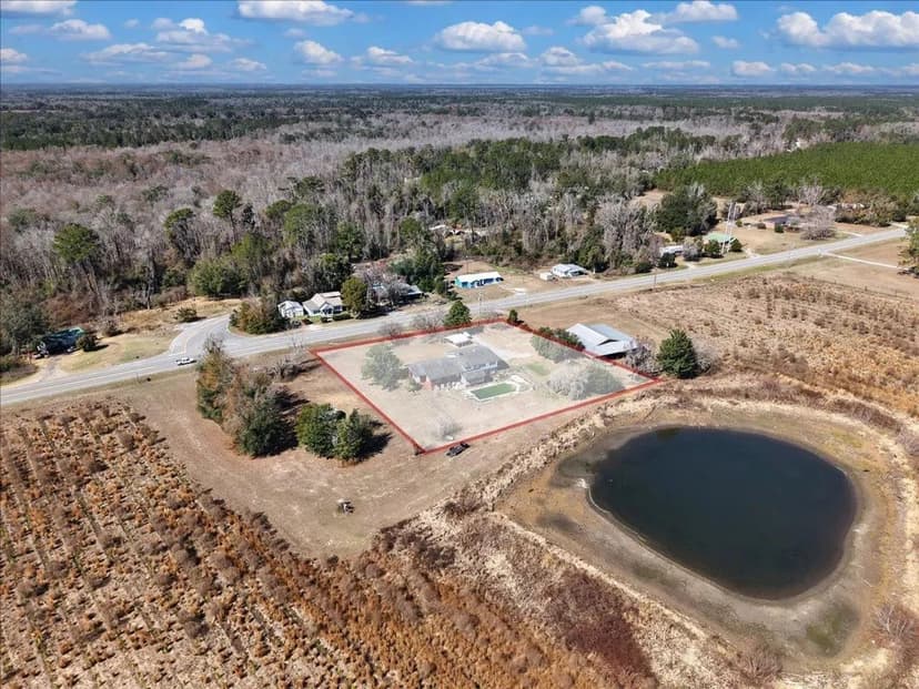 Spacious 5 Bedroom Pool Home with Sunroom, Multiple Living Areas & Covered Outdoor Spaces