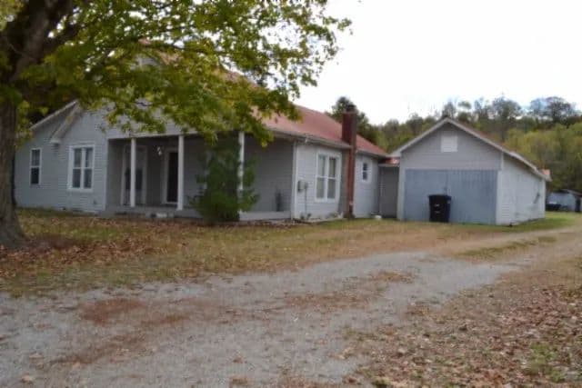 A HOME IN THE HEART OF CELINA, TN WITH 0.71 AC & OUTBUILDINGS. 