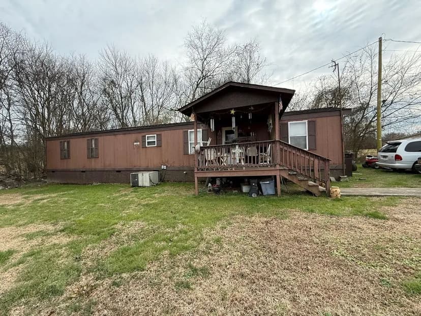 1.58+-acres with Mobile Home and Commercial Garage.