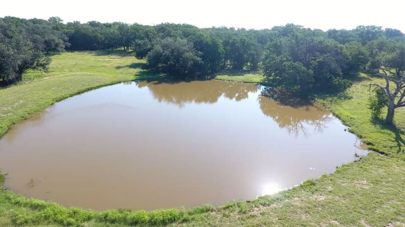 12.78 Acres for Sale in Tolar TX Pond, Oaks & Paved Road Frontage
