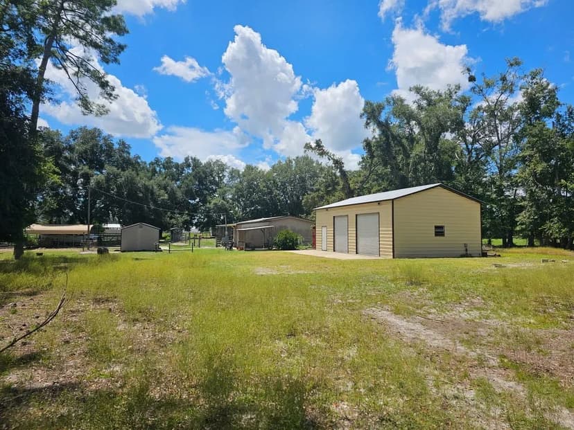 10 Acres – Fenced Pasture, Multiple Outbuildings, and Livable Mobile Home
