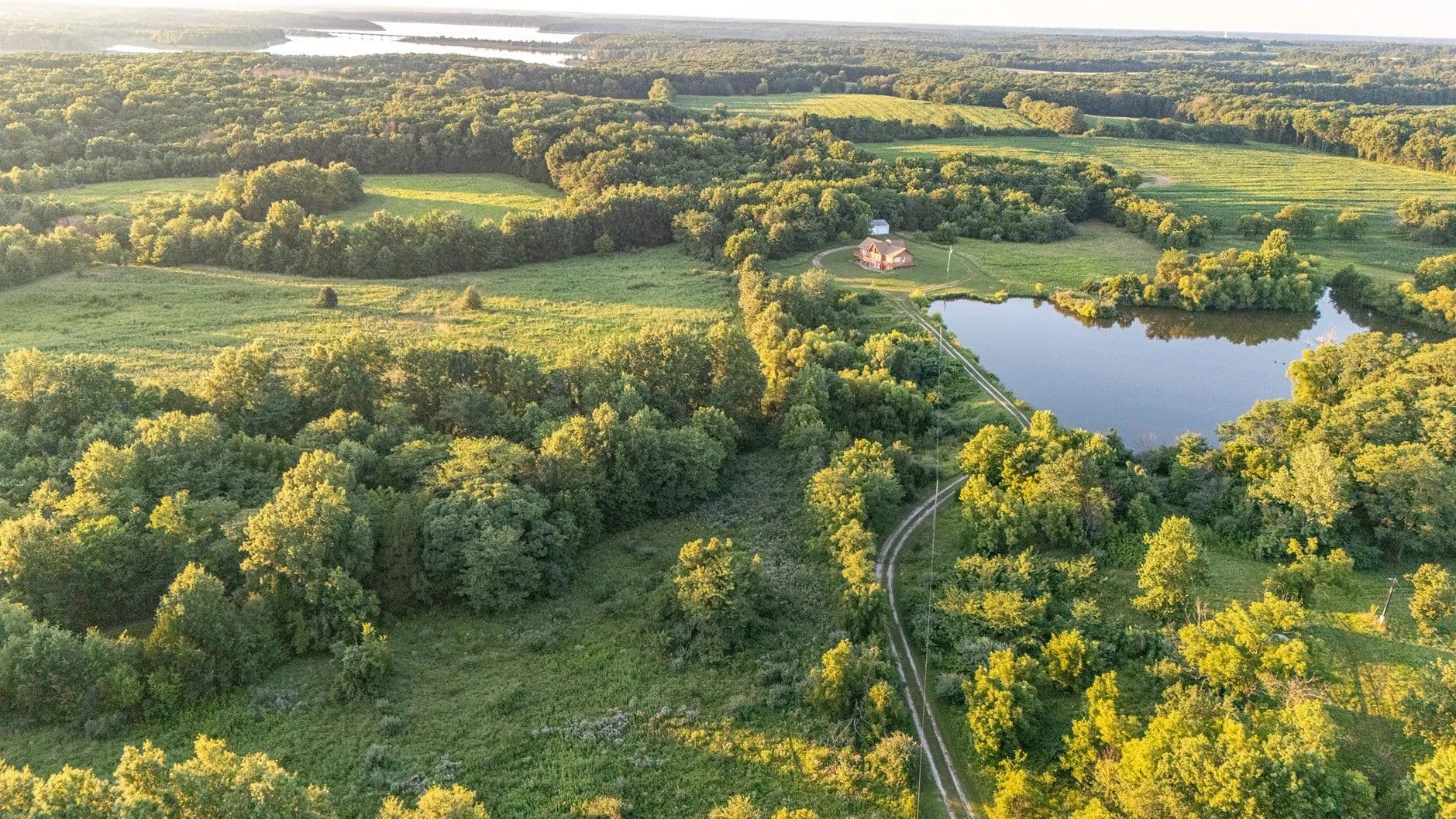 17-Acre Private Escape with Stocked Lake and Custom Home – Monroe County - Perry, Missouri, 63462
