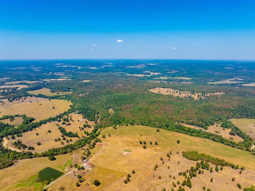 408 +/- Acre Turn-key Cattle Ranch with Custom Home, Creek & Guest Houses in the Ozarks