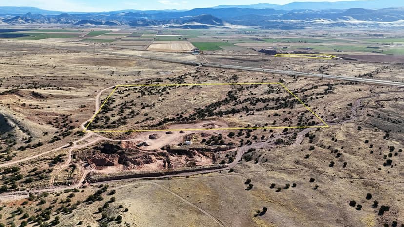 40 acres near Richfield with gravel resources, 14-acre yard, varied rock products, power nearby, and negotiable acreage and water rights.