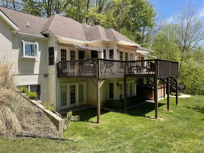 Land for sale outside Batesville, IN with exquisite 5000+ sq ft house on over 7 acres with a pond.